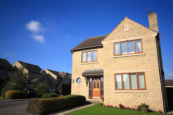 Large modern detached house with oak effect leaded windows