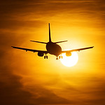 Airplane Taking Off at Sunset