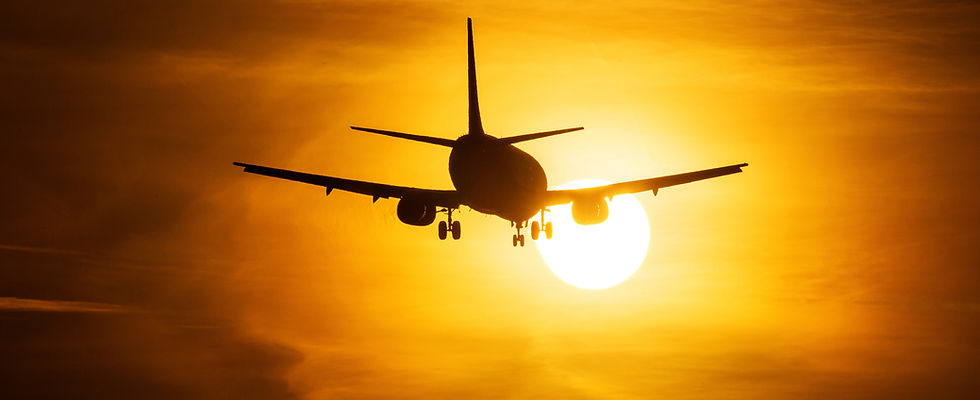 Airplane Taking Off at Sunset