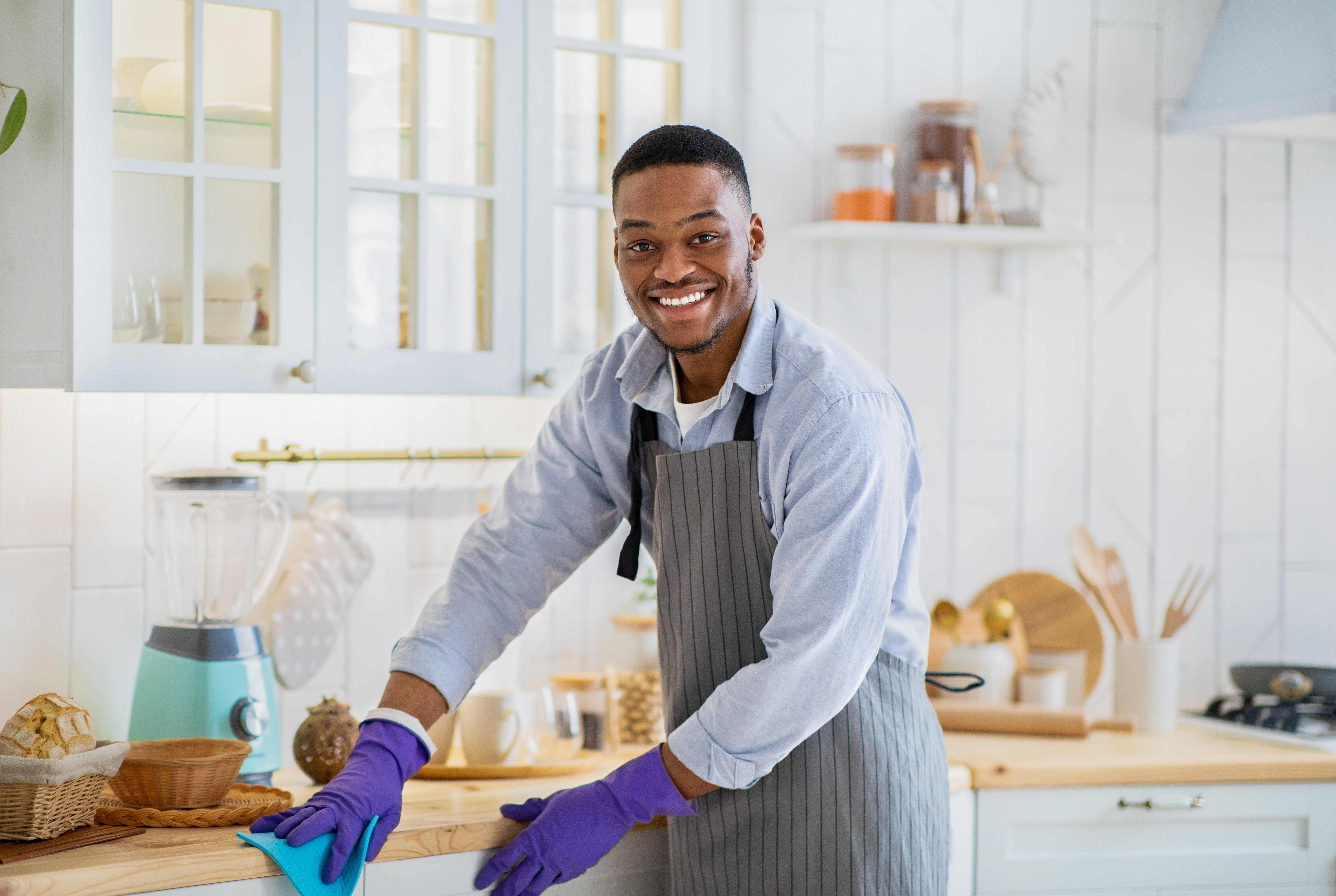 Man Cleaning Kitchen