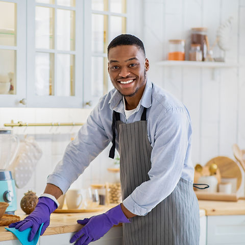 Man Cleaning Kitchen