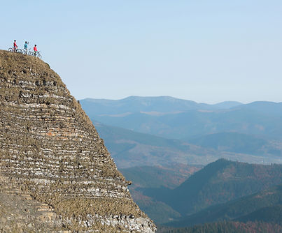 Cyclists On Cliff