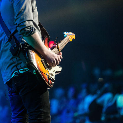 A guitarist playing onstage