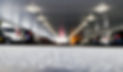 Vehicles In Illuminated Parking Lot