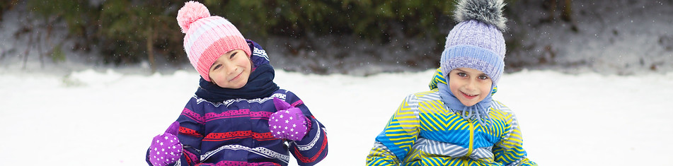 Kids Sledding Outdoors