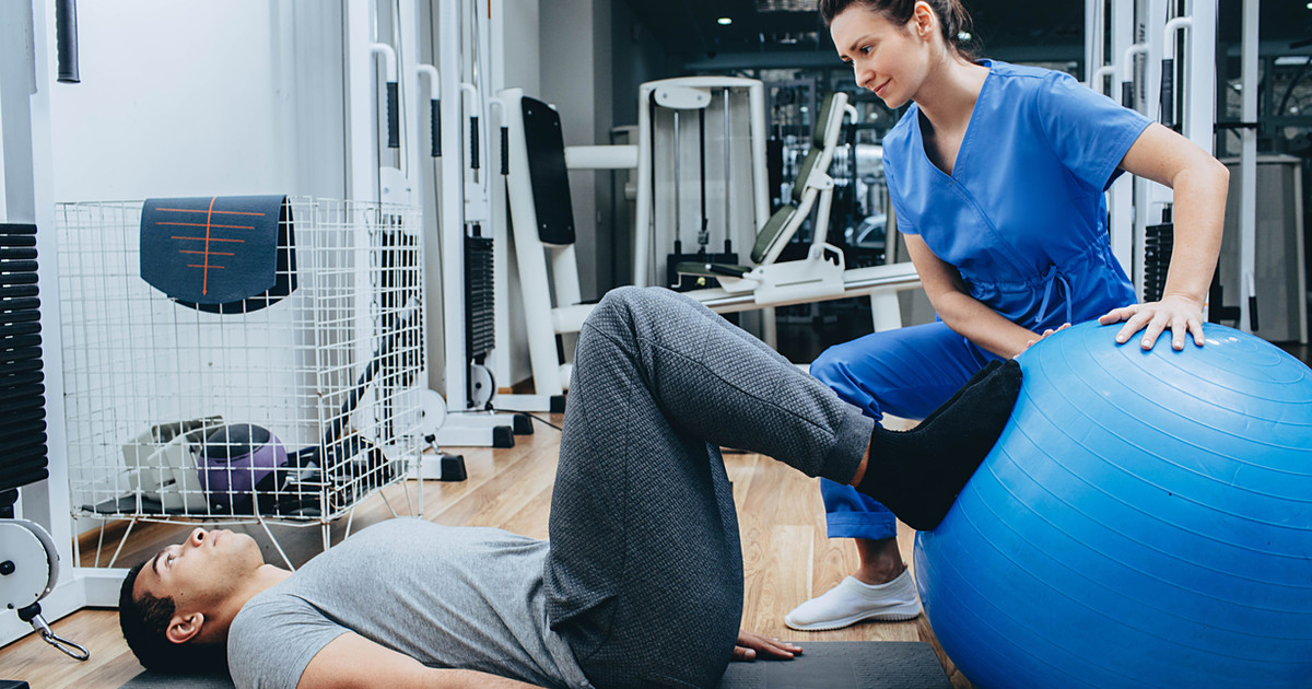 A person gradually returning to movement while their nervous system, muscles and joints adapt during recovery from persistent pain.