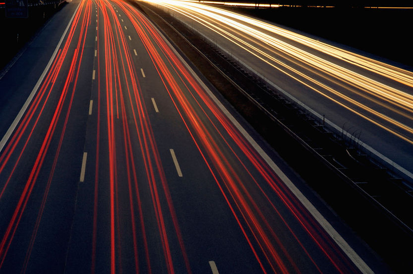 Taillights Glowing on a Highway at Night