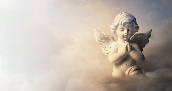 Angel Statue in Clouds