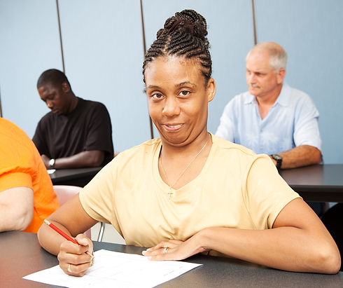 Adult college student with cerebral palsy taking a test