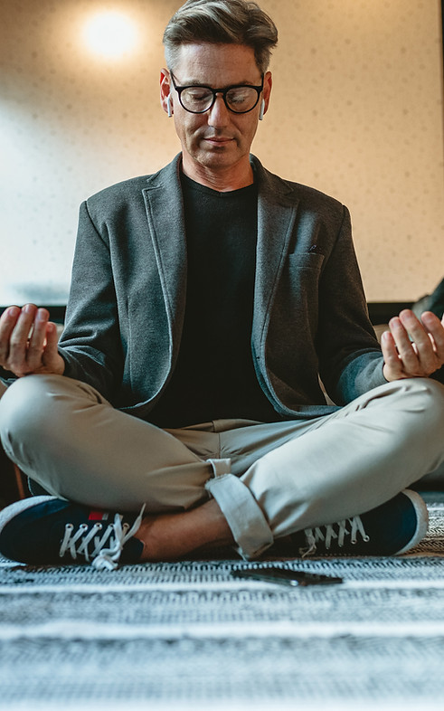 Man Meditating Indoors
