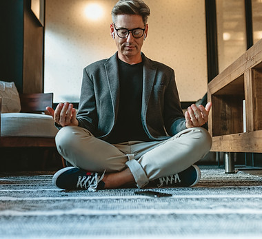 Man Meditating Indoors