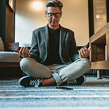 Man Meditating Indoors