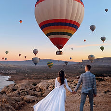 Couple with hot air balloons
