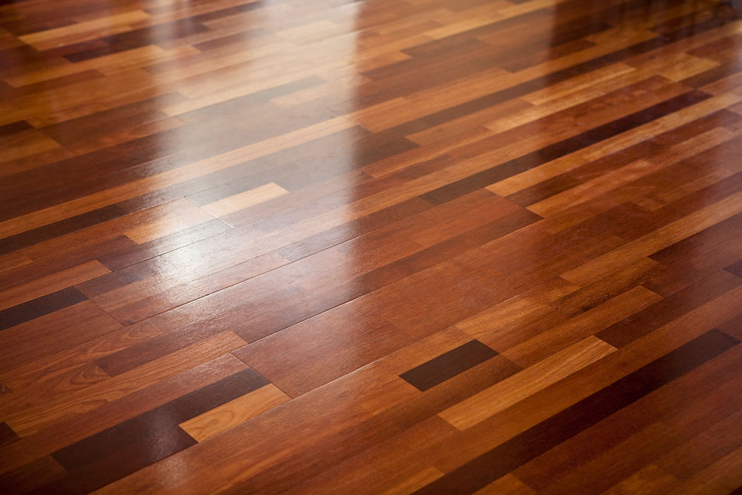 Smooth, polished hardwood floor with rich brown tones