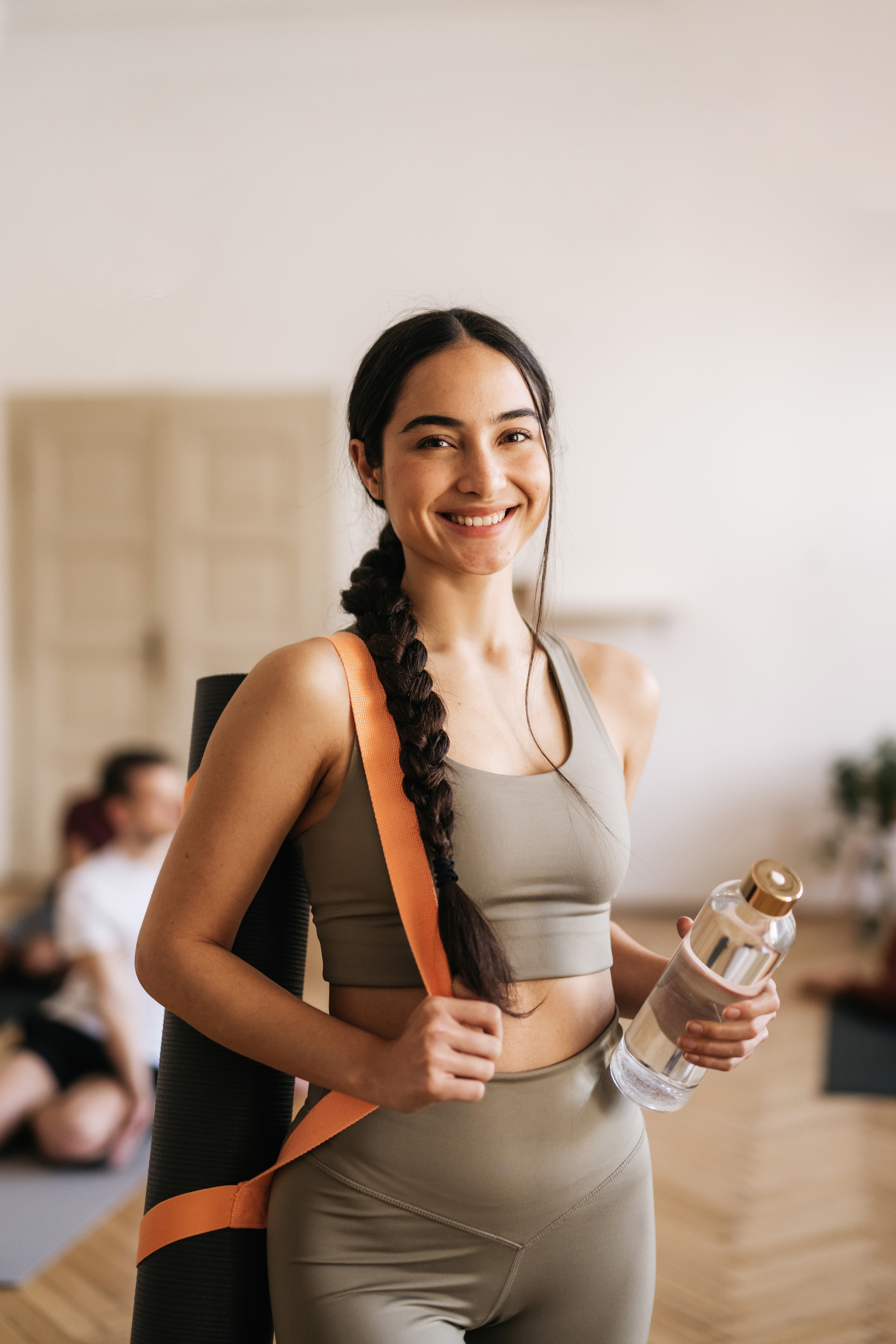 Woman Holding Yoga Mat