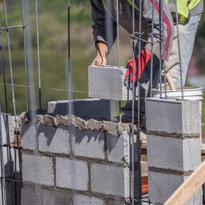 Mason working on a durable structure covered by Gaylord Insurance.