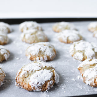 Delicious almond biscuits, freshly baked and dusted with powdered sugar