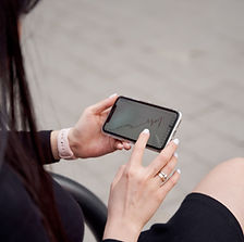 Person Checking Graphs on Smartphone
