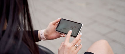 Person Checking Graphs on Smartphone