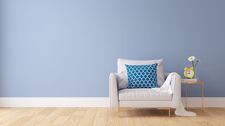 A freshly painted wall featuring a sofa