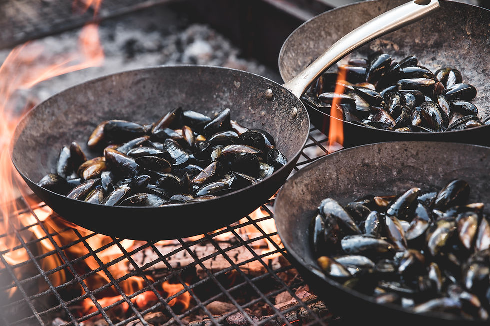 cooking muscles over campfire
