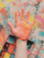 Paint-covered hand close-up