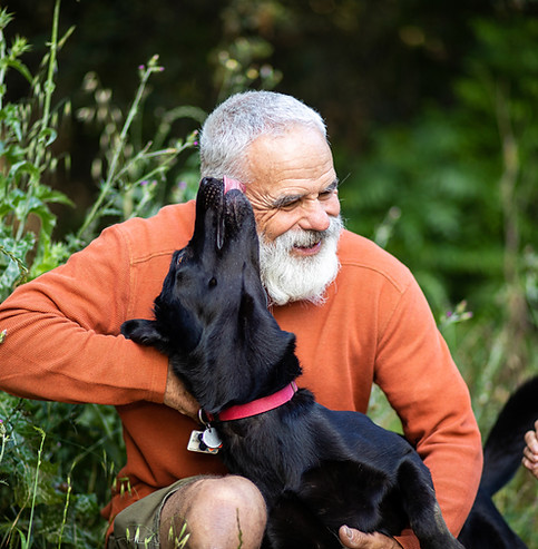 Man Hugging Dog