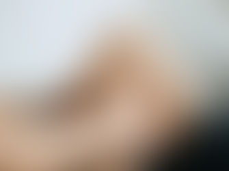 A man gripping a sore knee.