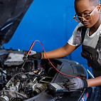 a man working on a car engine
