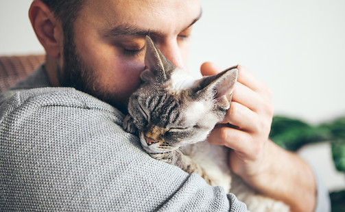 Man Hugging Cat