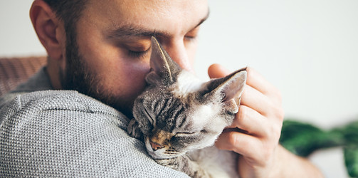 Man Hugging Cat