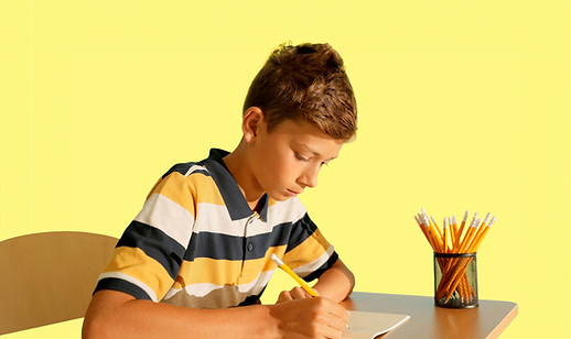 Boy Writing Notebook