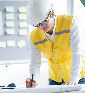 Engineer Looking At Blueprint