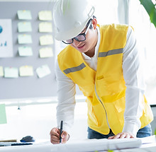 Engineer Looking At Blueprint