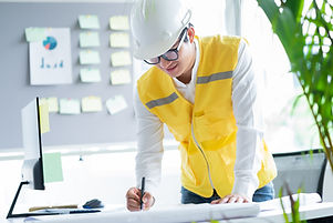 Engineer Looking At Blueprint
