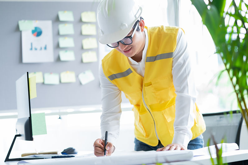 Engineer Looking At Blueprint