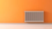 A radiator on a large orange wall