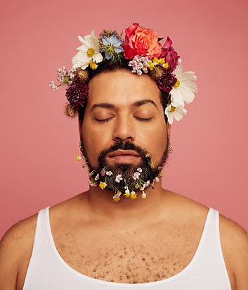 Portrait of man with flowers in his beard