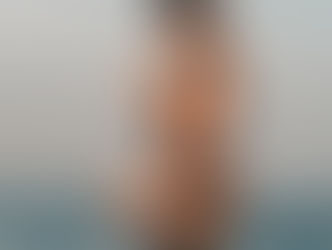 A calm, neutral woman-centered in reflection or steadiness — not distress.