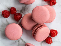 Homemade raspberry macaron with smooth shell and fruity raspberry ganache filling