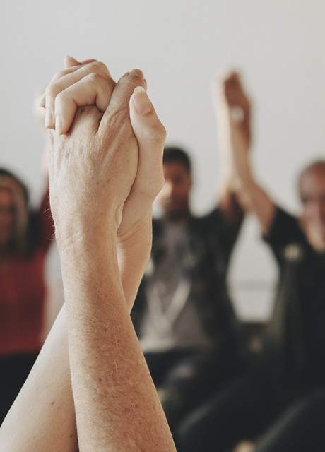 Holding Hands Up High