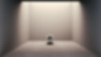 A shiny silver ball sits in an empty gray room, light shines from above