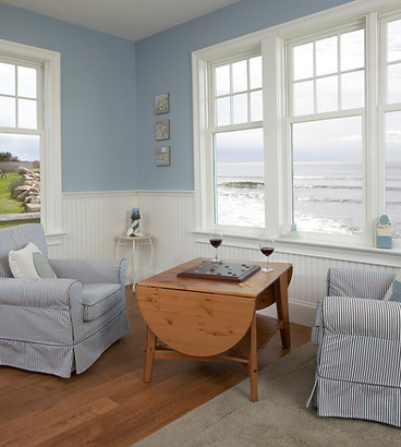 A relaxing environment of a beach cottage sitting room over-looking the ocean