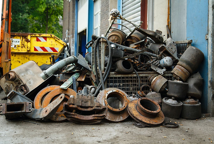 Scrap metal, old car parts in a garage