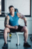 Man Sitting In Gym