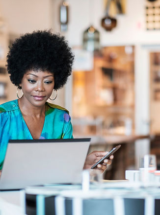 Store Owner Using Laptop