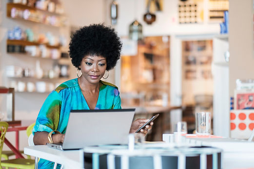 Store Owner Using Laptop