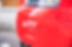 Red car bumper damage