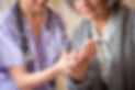 Nurse giving blood sugar test to patient