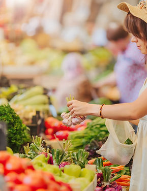 Woman Buying Vegetables
